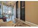 A view of the elevators on a nicely decorated floor with sitting area and chandelier at 3051 S Atlantic Ave # 1003, Daytona Beach, FL 32118
