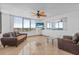 Bright living room offering tile flooring, a glass table, and beautiful views at 3051 S Atlantic Ave # 1003, Daytona Beach, FL 32118