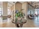 A decorative floral arrangement sits on a table in the beautifully decorated lobby at 3051 S Atlantic Ave # 1003, Daytona Beach, FL 32118