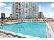 Relaxing community pool with comfortable lounge seating and ocean views at 3051 S Atlantic Ave # 1003, Daytona Beach, FL 32118