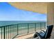 Serene balcony with a comfortable chair offering breathtaking ocean views at 3315 S Atlantic Ave # 1605, Daytona Beach Shores, FL 32118