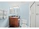 Bathroom featuring granite vanity with a dark wood cabinet and white tiled walk-in shower at 3315 S Atlantic Ave # 1605, Daytona Beach Shores, FL 32118