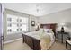 Comfortable bedroom with a queen bed, a large window, and neutral decor at 3315 S Atlantic Ave # 1605, Daytona Beach Shores, FL 32118