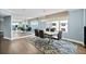Open-concept dining area features sleek table and chairs with bright beach views at 3315 S Atlantic Ave # 1605, Daytona Beach Shores, FL 32118