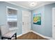 Entryway with a view, wood floors, and an accent chair at 3315 S Atlantic Ave # 1605, Daytona Beach Shores, FL 32118