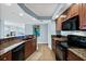 Kitchen with views of dining area and ocean, featuring granite countertops at 3315 S Atlantic Ave # 1605, Daytona Beach Shores, FL 32118