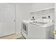 Bright, white laundry room featuring a front loading washer and dryer at 3315 S Atlantic Ave # 1605, Daytona Beach Shores, FL 32118