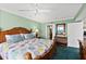 Spacious main bedroom with wood furnishings, ocean view, and ensuite bathroom at 3315 S Atlantic Ave # 1605, Daytona Beach Shores, FL 32118