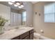 Neutral bathroom featuring a granite counter, modern fixtures, and decorative seahorse accents at 3428 Saltee Cir, Ormond Beach, FL 32174