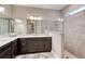 Elegant bathroom featuring a spacious vanity, walk-in shower, and neutral tile flooring at 3428 Saltee Cir, Ormond Beach, FL 32174