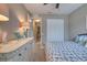 Cozy bedroom with a soft blue comforter, closet and white dresser at 3428 Saltee Cir, Ormond Beach, FL 32174