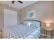 Cozy bedroom with neutral wall, queen size bed and carpet floor at 3428 Saltee Cir, Ormond Beach, FL 32174