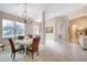 Dining area with neutral paint, a chandelier, and open view of the entryway at 3428 Saltee Cir, Ormond Beach, FL 32174