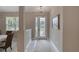 Inviting home entryway with tiled floor, decorative lights, and a decorative rug at 3428 Saltee Cir, Ormond Beach, FL 32174