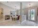 Inviting entryway and dining area featuring neutral walls and decorative lighting at 3428 Saltee Cir, Ormond Beach, FL 32174
