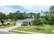 Well-manicured front lawn and landscaping enhance the curb appeal of this lovely home with a two-car garage at 3428 Saltee Cir, Ormond Beach, FL 32174