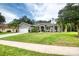 Beautiful single-story home with a green lawn and professional landscaping at 3428 Saltee Cir, Ormond Beach, FL 32174