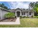 Charming single-story home with manicured lawn and professional landscaping at 3428 Saltee Cir, Ormond Beach, FL 32174