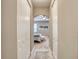 Hallway leading to a bedroom, featuring double closets and neutral wall color at 3428 Saltee Cir, Ormond Beach, FL 32174