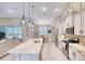 Bright kitchen features pendant lighting, stainless appliances, and breakfast nook at 3428 Saltee Cir, Ormond Beach, FL 32174