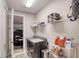 Convenient laundry room with shelving, storage, washer, and dryer at 3428 Saltee Cir, Ormond Beach, FL 32174