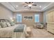 Calming main bedroom with tray ceiling, ceiling fan, and bright natural light at 3428 Saltee Cir, Ormond Beach, FL 32174