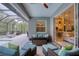 Cozy covered patio with a view through sliding doors to the kitchen and living area at 3428 Saltee Cir, Ormond Beach, FL 32174