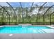 Beautiful screened pool features a waterfall feature, plenty of space for swimming and relaxing outdoors at 3428 Saltee Cir, Ormond Beach, FL 32174