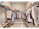 Walk-in closet featuring carpet flooring, wire shelving, and hanging storage space at 3428 Saltee Cir, Ormond Beach, FL 32174