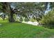 Backyard featuring a tree-lined lake at 3776 Sweet Grove Ct, Port Orange, FL 32129