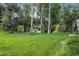 Beautiful backyard with a tranquil lake view at 3776 Sweet Grove Ct, Port Orange, FL 32129