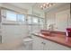 Bathroom featuring shower/tub combo, lavatory with coral countertops, and a white toilet at 3776 Sweet Grove Ct, Port Orange, FL 32129