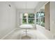 Bright breakfast nook with large windows providing natural light and views of the outdoors, perfect for casual dining at 3776 Sweet Grove Ct, Port Orange, FL 32129