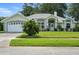 Charming single-story home with a well-manicured lawn and attached two-car garage at 3776 Sweet Grove Ct, Port Orange, FL 32129
