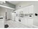 Bright kitchen featuring white cabinetry and modern appliances, including a built-in microwave at 3776 Sweet Grove Ct, Port Orange, FL 32129