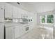 Well-maintained kitchen with white cabinets, modern appliances, and ample counter space, perfect for home cooking at 3776 Sweet Grove Ct, Port Orange, FL 32129