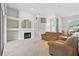 Bright living room features high ceilings, fireplace, and plush carpeting, perfect for relaxing and entertaining at 3776 Sweet Grove Ct, Port Orange, FL 32129