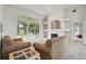 Spacious living room with fireplace and large sliding glass doors offering scenic views, perfect for entertaining at 3776 Sweet Grove Ct, Port Orange, FL 32129