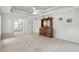 Spacious main bedroom with tray ceiling and adjoining ensuite bathroom, offering a private and luxurious retreat at 3776 Sweet Grove Ct, Port Orange, FL 32129