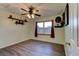 This bedroom has wood look floors, a ceiling fan, and decorative shelving at 4204 Rocky Ridge Pl, Sanford, FL 32773