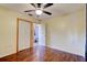 This bedroom has hardwood floors, a ceiling fan and plenty of closet space at 4204 Rocky Ridge Pl, Sanford, FL 32773