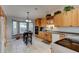 Kitchen boasting wood cabinetry, granite countertops, and a breakfast nook with bay windows at 4204 Rocky Ridge Pl, Sanford, FL 32773