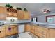 Kitchen with wood cabinetry, granite countertops, and stainless steel appliances at 4204 Rocky Ridge Pl, Sanford, FL 32773