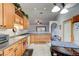Kitchen with wooden cabinets, granite countertops, and stainless steel appliances at 4204 Rocky Ridge Pl, Sanford, FL 32773
