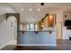 Kitchen featuring breakfast bar, wood cabinets, and vaulted ceiling at 4204 Rocky Ridge Pl, Sanford, FL 32773