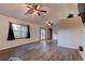 Bright living room featuring hardwood floors, vaulted ceilings, and access to the kitchen at 4204 Rocky Ridge Pl, Sanford, FL 32773