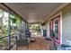 Relax on the large screened patio with brick floors, outdoor seating and a view of the yard at 4204 Rocky Ridge Pl, Sanford, FL 32773