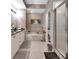 Luxurious bathroom with soaking tub, granite countertops, and modern fixtures at 424 Luna Bella Ln # 330, New Smyrna Beach, FL 32168