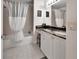 Bathroom featuring granite countertops, vanity and shower-tub combo at 424 Luna Bella Ln # 330, New Smyrna Beach, FL 32168