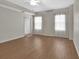 Spacious bedroom with hardwood floors, ceiling fan, and natural light at 424 Luna Bella Ln # 330, New Smyrna Beach, FL 32168